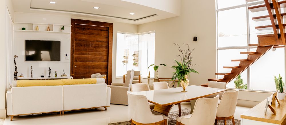Airy living and dining space with large windows