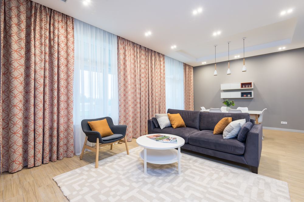 Contemporary living room with a spacious sofa and warm wood accents
